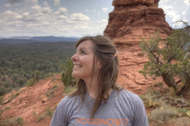 Woman Gazing Upward Amid Sedona Red Rock Formations