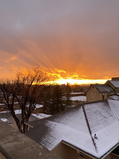 Sunset on a Snowy Rooftop