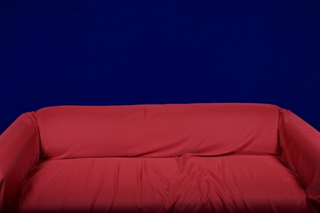 Vibrant Red Couch in Blue Surroundings