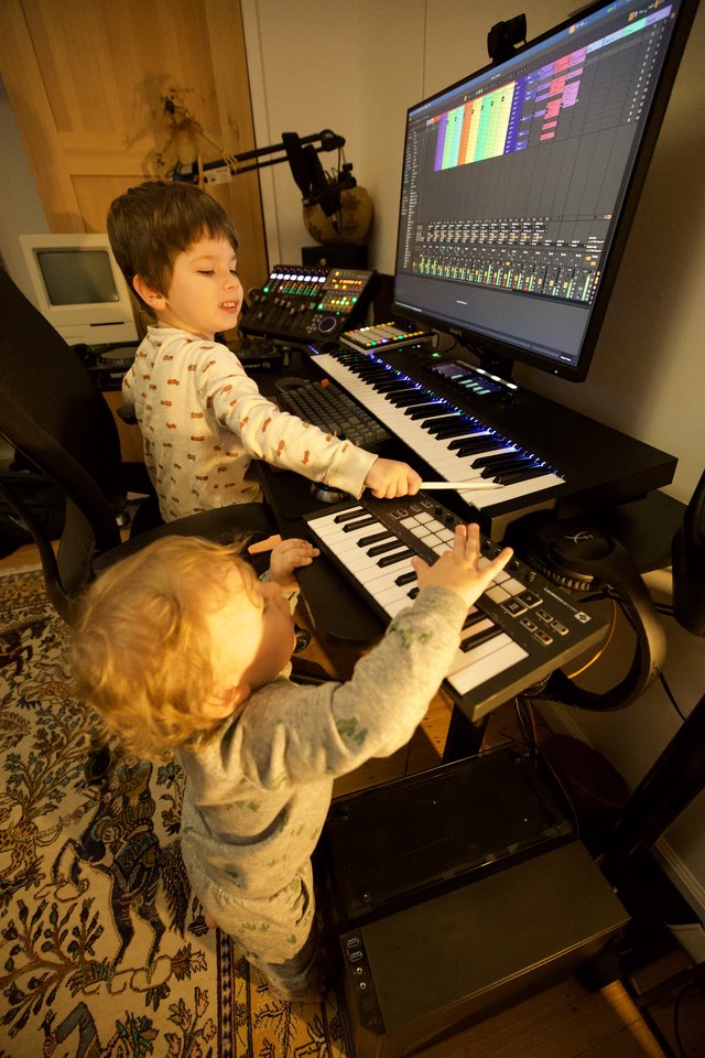 Young Children Making Music in Home Recording Studio
