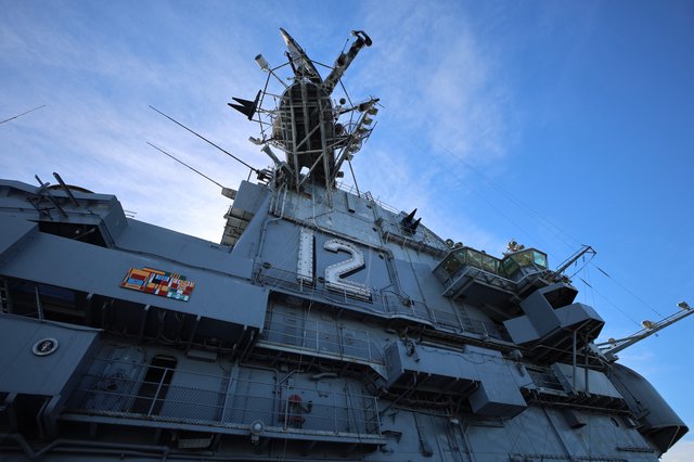 USS Hornet Island Superstructure Rising Against Blue Sky