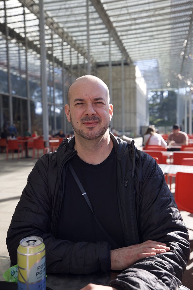 Portrait at Modern Public Space with Red Seating