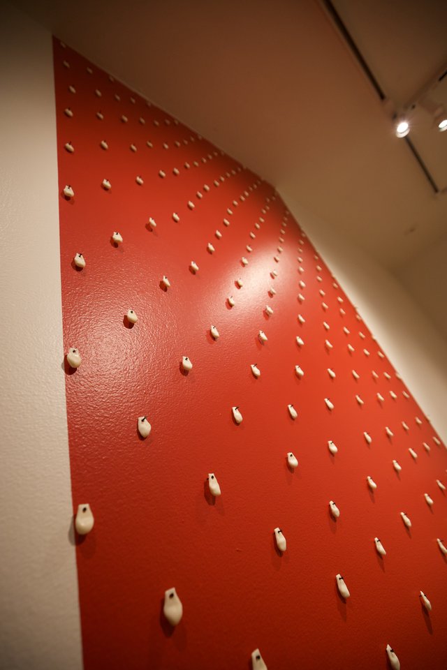 Red Pegboard Installation with Geometric Peg Pattern