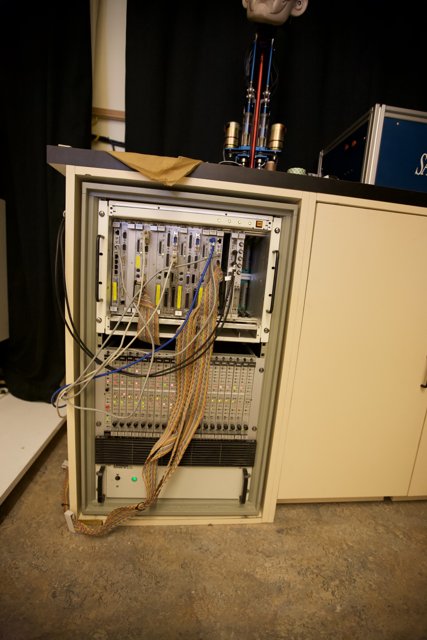 Inside the Cabinet: A Tangle of Wires and Cables