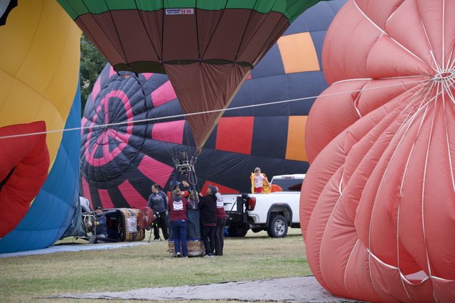 Ground Crew Prepares Hot Air Balloons for Launch