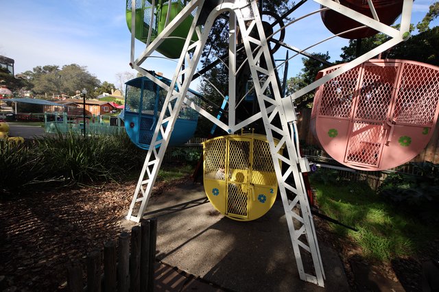 Vintage Ferris Wheel with Colorful Gondolas at Amusement Park
