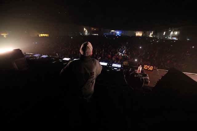 DJ Commands Massive Festival Crowd at Midnight