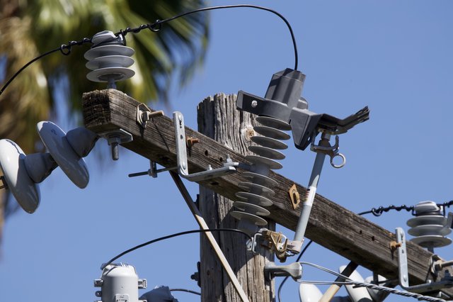 Weathered Electrical Pole with Insulators and Hardware