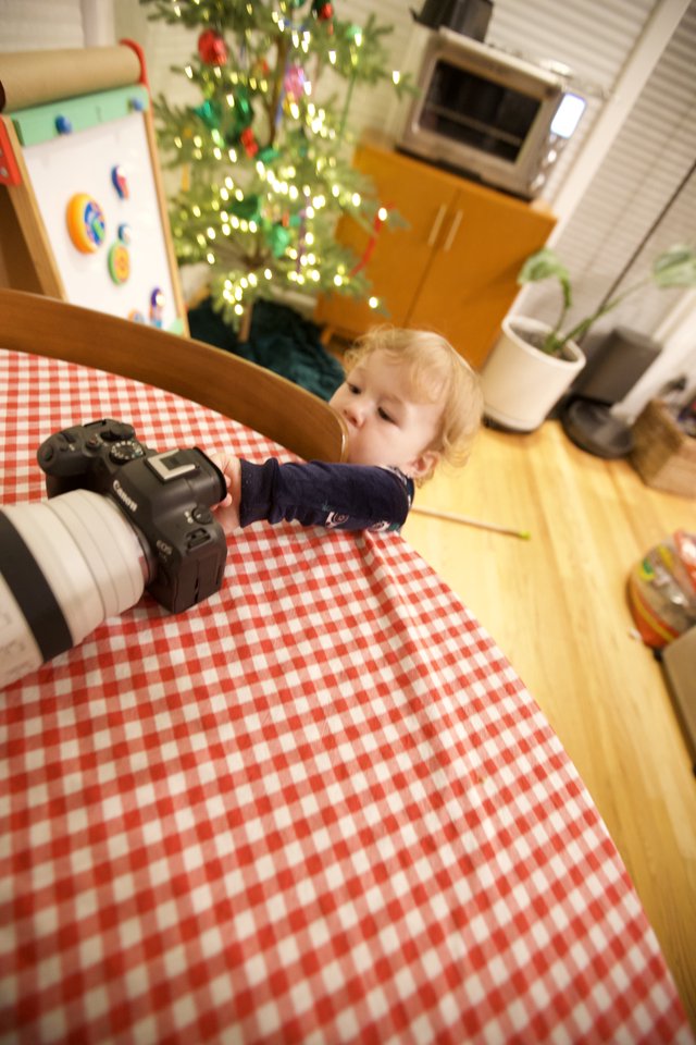 Toddler's Curious Encounter with Camera on Christmas Morning