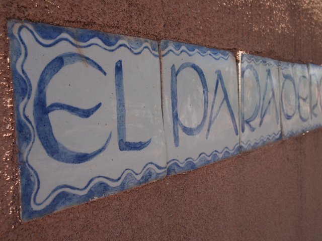 Blue and White Tile Sign on Wall