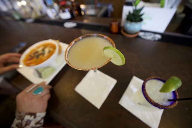 Margaritas and Mexican Cuisine at Restaurant Table
