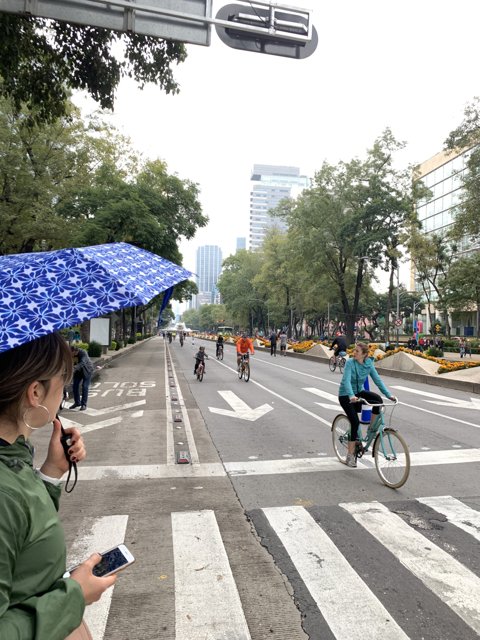 Riding through the City with an Umbrella