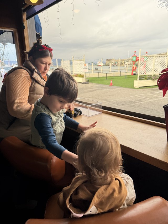 Children Learning Together at Museum Window Display