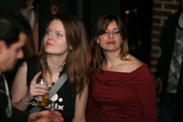 Two Women at a Dimly Lit Evening Event 2006