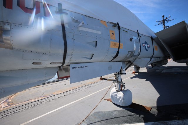 Close-Up of Vintage Military Aircraft Landing Gear and Fuselage