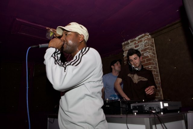Steve J performing live with a microphone