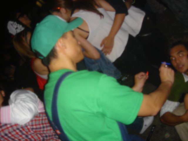 Green-Shirted Man at the Club