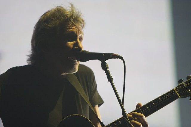 Roger Waters Rocks the Stage with His Guitar and Mic