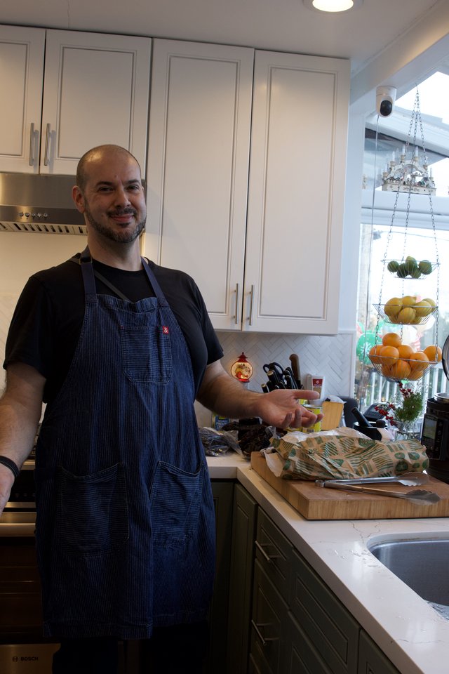 Home Chef Preparing Christmas Eve Dinner in Modern Kitchen