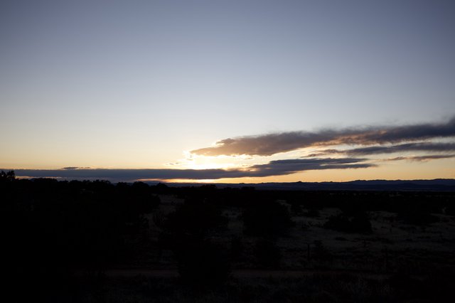 Dramatic Sunset Over Desert Landscape at Twilight