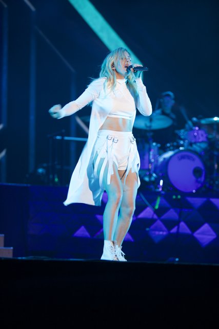 Woman in White Lights Up Coachella Stage