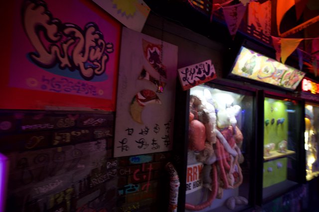 Retro Japanese Arcade Claw Machines and Graffiti Art