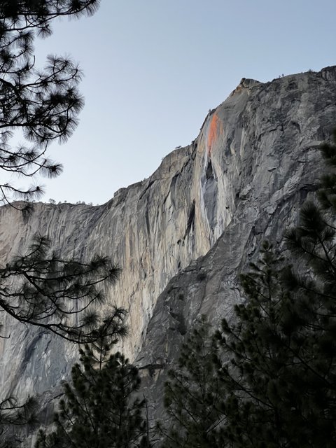 Red Line Etched onto Majestic Cliff Face