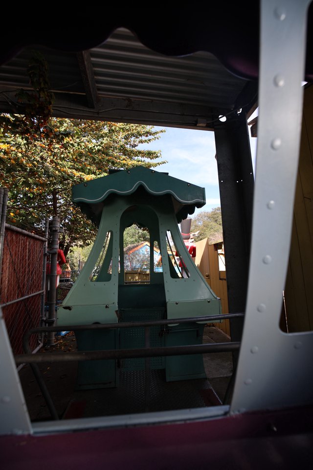 Pagoda Ride Structure Framed Through Metal Doorway