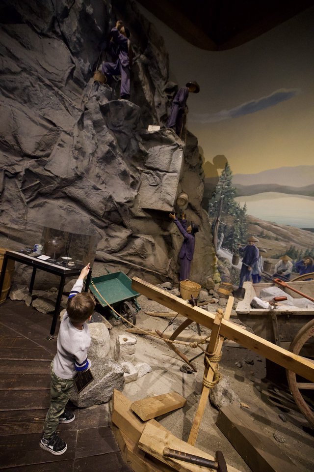Child Exploring Interactive Museum Mining Exhibit Display