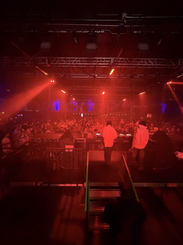 Electronic Music Performance with Red Stage Lighting