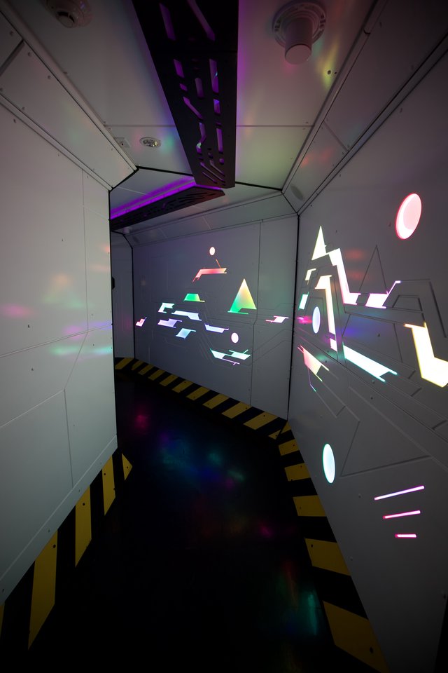 Futuristic Sci-Fi Corridor with Geometric Light Projections