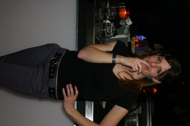 Woman Poses Thoughtfully at New Year's Eve Bar