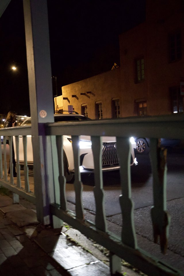 Night View Through Turquoise Railing in Santa Fe