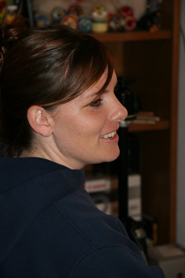 Candid Profile Portrait of Smiling Woman Indoors