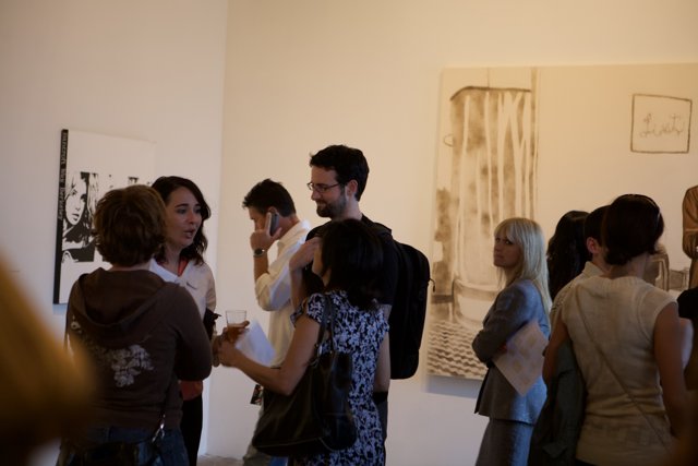 Gallery-goers admiring artwork