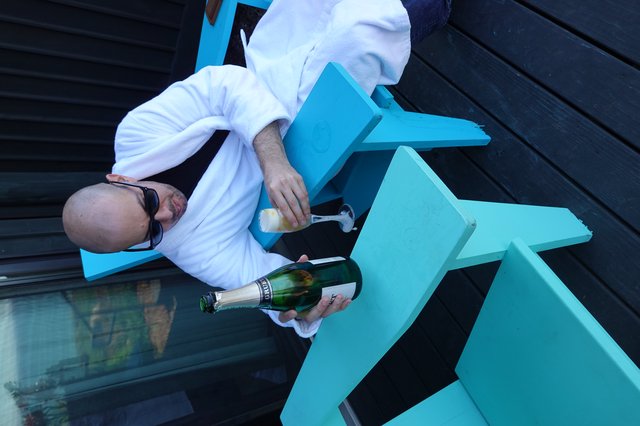 Dave Enjoying Champagne in Bathrobe Outdoors