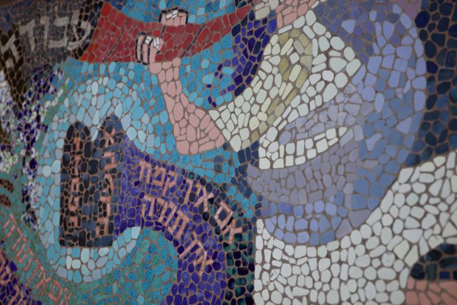 Tile Mosaic Wall with Man and Baby
