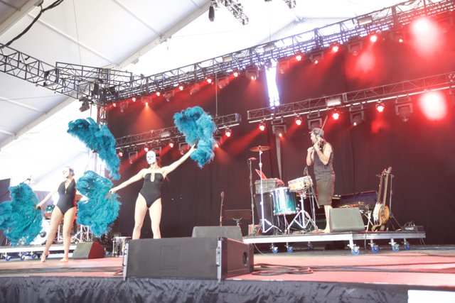 Blue Feathered Dancers on Stage