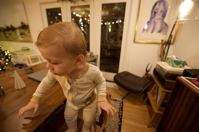 Toddler Exploring Cozy Living Room at Night