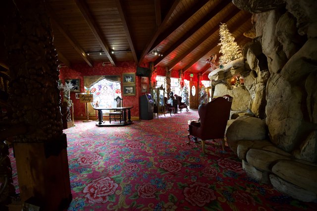 Madonna Inn's Ornate Red-Themed Interior Room with Stone Features