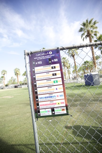 Coachella Advertisement Fence Sign with Palm Trees