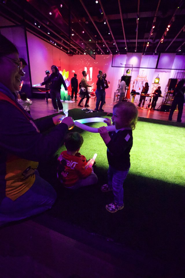 Children Enjoying Interactive Light Installation at Baby Rave