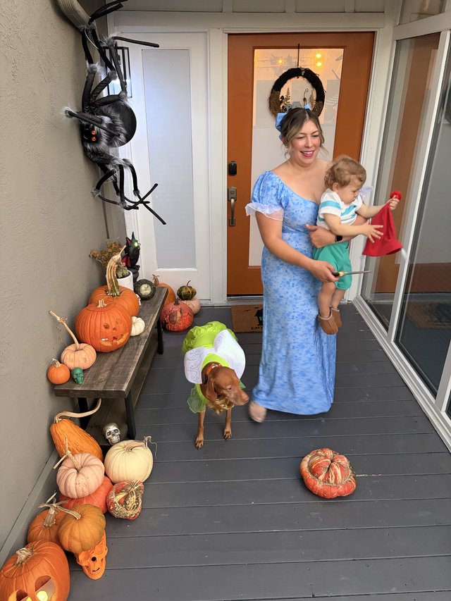 Halloween Porch Display with Family in Costume