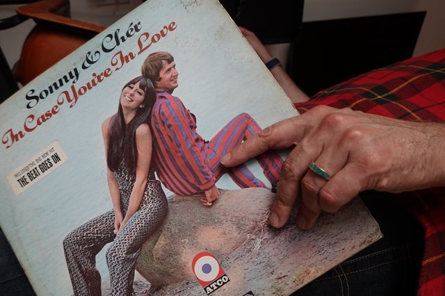 Vintage Record Album Being Displayed by Hand