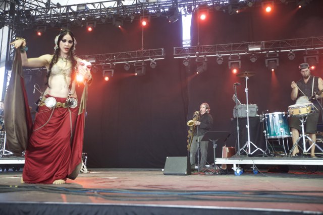 Woman in Red Dress Rocks the Stage at Coachella 2012