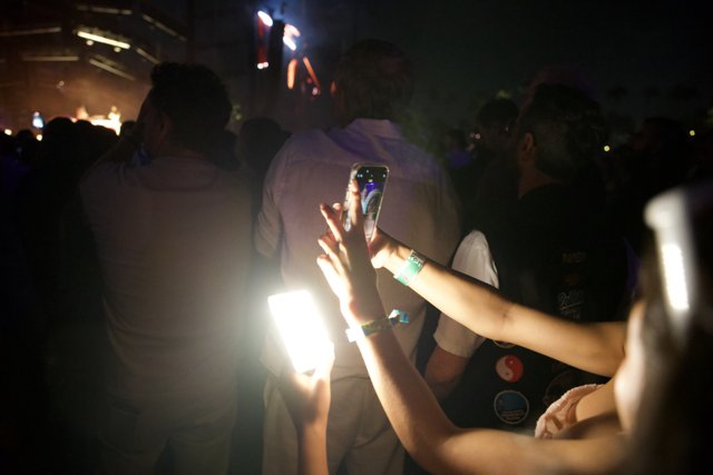 Illuminated Moments: Coachella 2024 Night Scene