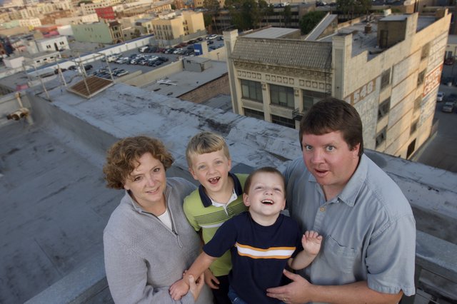 Family Portrait on Urban Rooftop at Dusk