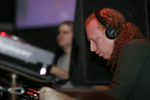 Red-haired DJ in Headphones