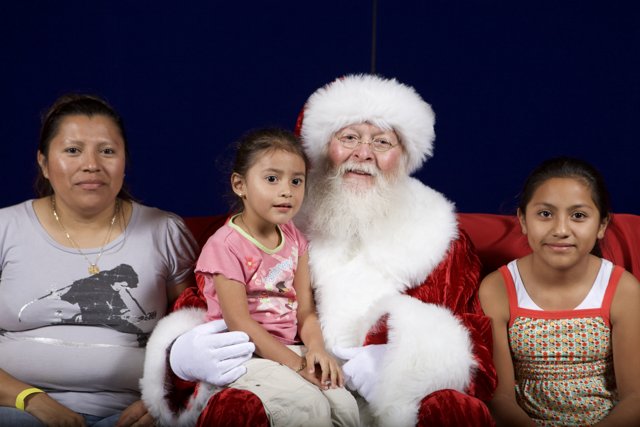 Santa Claus Spreading Joy with Children and Adult