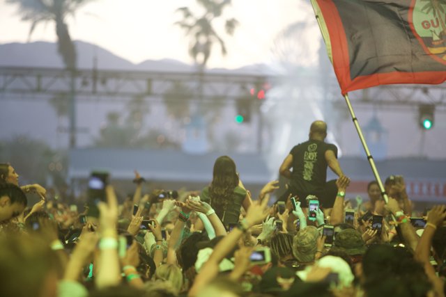 Flag Waves High in the Coachella Crowd